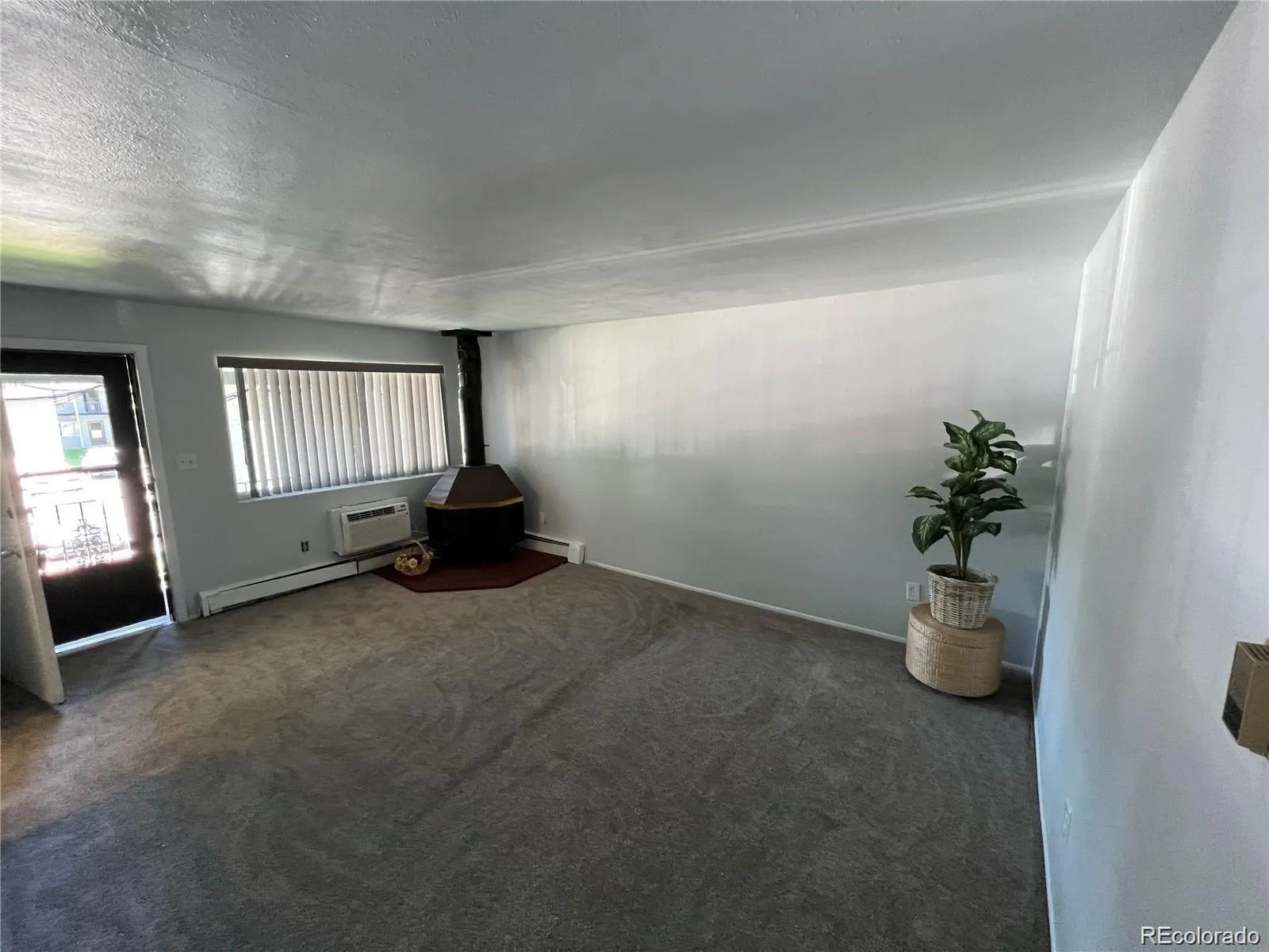 Empty room with windows at 2565 South Sheridan Boulevard Unit 20, Denver